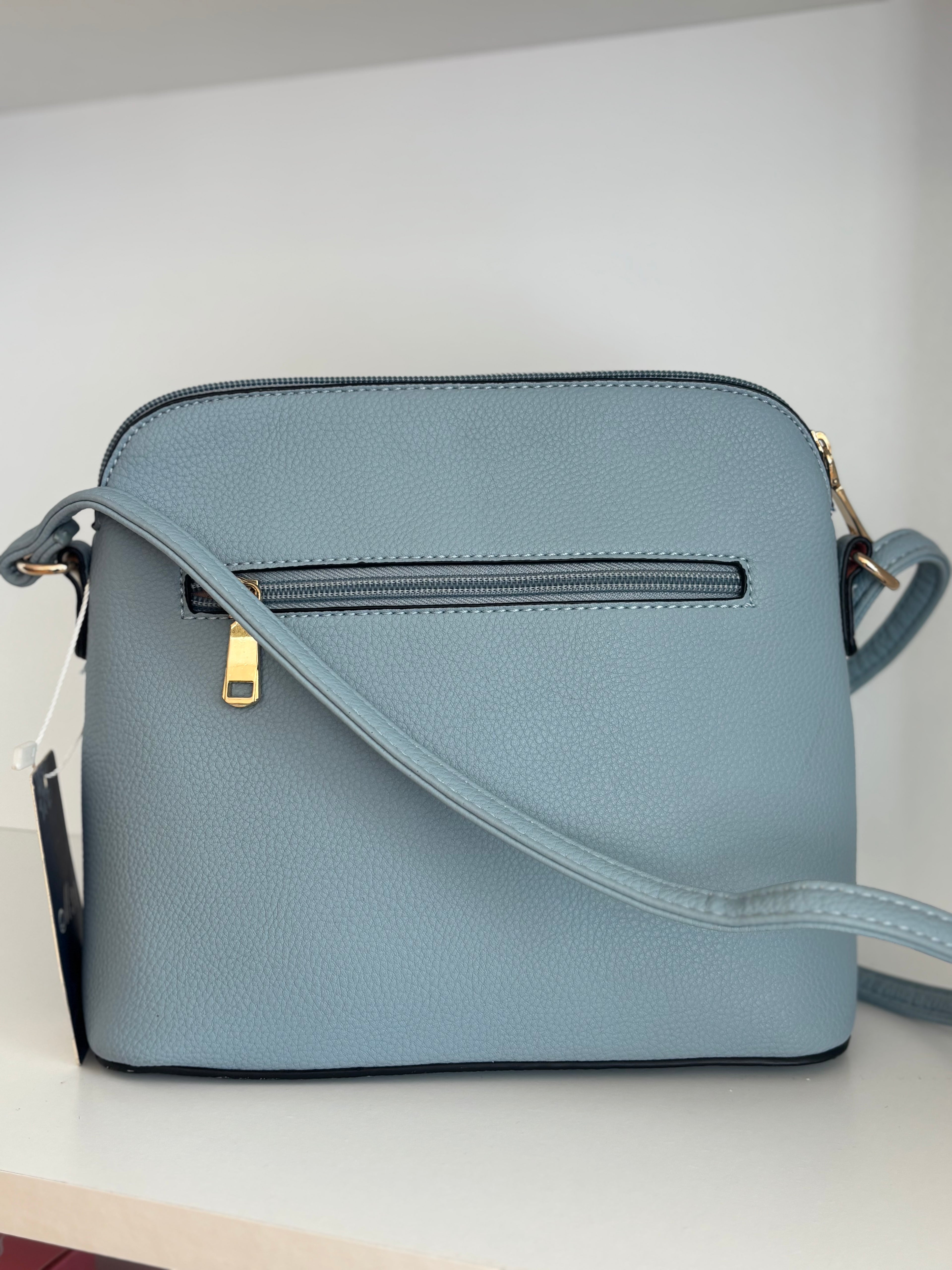 Bolso azul borlas