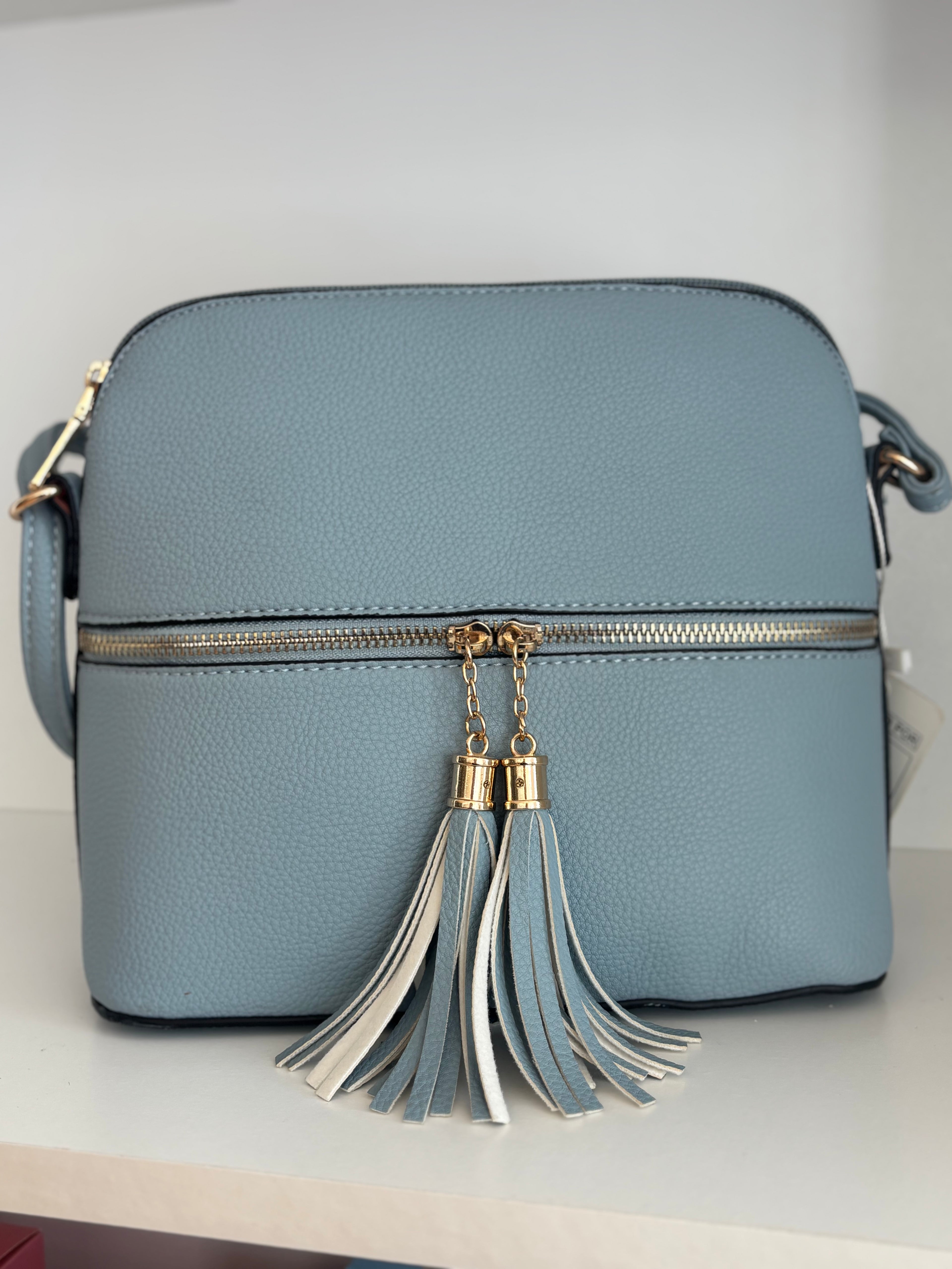 Bolso azul borlas